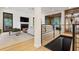 Open concept living room with a fireplace, large windows, and modern staircase at 1 Habersham Nw Way, Atlanta, GA 30305