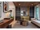 Modern living room featuring custom cabinetry and wood slat ceiling at 1 Habersham Nw Way, Atlanta, GA 30305