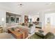 Bright living room with large sectional sofa, hardwood floors, and modern lighting fixtures at 1 Habersham Nw Way, Atlanta, GA 30305