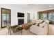 Cozy living room with fireplace, TV, and comfortable seating, perfect for relaxing and entertaining at 1 Habersham Nw Way, Atlanta, GA 30305