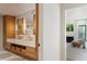 Luxurious main bathroom featuring double vanity, marble countertops, wood cabinetry, and elegant fixtures at 1 Habersham Nw Way, Atlanta, GA 30305