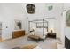 Main bedroom with large canopy bed, neutral color palette, and modern lighting fixture at 1 Habersham Nw Way, Atlanta, GA 30305
