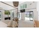 Spacious main bedroom with fireplace, TV, access to the backyard, and canopy bed at 1 Habersham Nw Way, Atlanta, GA 30305