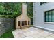 Beautiful outdoor fireplace on stone patio, perfect for outdoor gathering and relaxation in any season at 1 Habersham Nw Way, Atlanta, GA 30305
