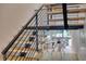 Striking staircase design, featuring wooden steps and an open-concept living area at 1 Habersham Nw Way, Atlanta, GA 30305