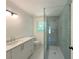 Bathroom featuring walk-in shower with glass door and vanity with a sink at 1892 Mercedes Ne Ct, Atlanta, GA 30345