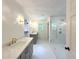 New bathroom with double vanity, marble countertop, and frameless glass shower at 1892 Mercedes Ne Ct, Atlanta, GA 30345
