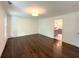 Bright bedroom features hardwood floors, modern lighting, and a view to an ensuite bathroom at 1892 Mercedes Ne Ct, Atlanta, GA 30345