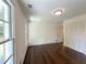 Bedroom with hardwood floors, natural light, and closet with bifold doors at 1892 Mercedes Ne Ct, Atlanta, GA 30345