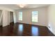 Bright bedroom with hardwood floors, closet space, and large windows at 1892 Mercedes Ne Ct, Atlanta, GA 30345