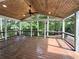 Covered deck with a wood ceiling, ceiling fan, and views of the surrounding trees at 1892 Mercedes Ne Ct, Atlanta, GA 30345