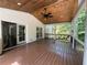 Spacious covered deck with wood ceiling, ceiling fan, and seamless indoor-outdoor living at 1892 Mercedes Ne Ct, Atlanta, GA 30345