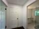 Hallway showcasing the bathroom with sleek glass shower and vanity at 1892 Mercedes Ne Ct, Atlanta, GA 30345