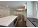 Spacious kitchen with an island, dark countertops, stainless steel appliances, and hardwood floors at 1892 Mercedes Ne Ct, Atlanta, GA 30345