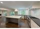 Bright, open kitchen featuring an island, stainless steel appliances, and hardwood floors at 1892 Mercedes Ne Ct, Atlanta, GA 30345