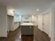 Newly remodeled kitchen with a center island, white cabinetry, and sleek countertops at 1892 Mercedes Ne Ct, Atlanta, GA 30345