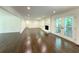Spacious living room with hardwood floors, a fireplace, and French doors at 1892 Mercedes Ne Ct, Atlanta, GA 30345