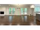 Open-concept living area with hardwood floors, fireplace, and seamless access to the outdoors at 1892 Mercedes Ne Ct, Atlanta, GA 30345