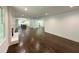 Spacious open-concept living room with hardwood floors and neutral paint at 1892 Mercedes Ne Ct, Atlanta, GA 30345