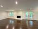 Spacious living room with fireplace, hardwood floors and double doors at 1892 Mercedes Ne Ct, Atlanta, GA 30345