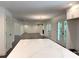 Open-concept living area with hardwood floors, fireplace, and French doors leading to the backyard at 1892 Mercedes Ne Ct, Atlanta, GA 30345