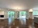 Bright living space with hardwood floors, fireplace and large doors leading to outdoor deck at 1892 Mercedes Ne Ct, Atlanta, GA 30345