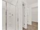 A modern bathroom showcases a glass-enclosed shower with sleek fixtures at 25 Amberjack Trl, Covington, GA 30016