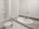 Bathroom features a shower, sink, and toilet at 25 Amberjack Trl, Covington, GA 30016