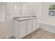 A well-lit bathroom features a double vanity, bathtub, and a large mirror at 25 Amberjack Trl, Covington, GA 30016