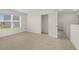 Bright bedroom with large window, neutral carpet, and ensuite bathroom access at 25 Amberjack Trl, Covington, GA 30016