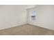 Bright bedroom with a large window at 25 Amberjack Trl, Covington, GA 30016