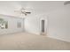 Spacious bedroom featuring plush carpet, natural light, and neutral tones at 25 Amberjack Trl, Covington, GA 30016
