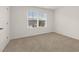 Bright bedroom with large window and neutral carpet at 25 Amberjack Trl, Covington, GA 30016