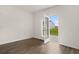Sunlit room features wood floors and sliding glass doors to the yard at 25 Amberjack Trl, Covington, GA 30016