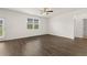 Bright room with hardwood floors, a ceiling fan, and a window overlooking the yard at 25 Amberjack Trl, Covington, GA 30016
