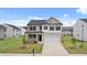 Charming two-story home with a two car garage and well-maintained front yard at 25 Amberjack Trl, Covington, GA 30016