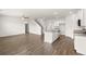 An open-concept living space features hardwood floors and ample natural light at 25 Amberjack Trl, Covington, GA 30016