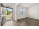 Bright living room featuring hardwood floors, a large window, and an inviting view at 25 Amberjack Trl, Covington, GA 30016