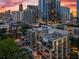 Aerial view of condo building with city skyline at dusk at 905 Juniper Ne St # 808, Atlanta, GA 30309
