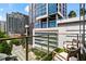 Balcony seating area overlooking a city street with high-rise buildings at 905 Juniper Ne St # 808, Atlanta, GA 30309