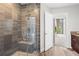 Glass-enclosed walk-in shower and updated cabinetry in the bathroom at 905 Juniper Ne St # 808, Atlanta, GA 30309