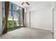 Bright bedroom with large windows offering city views and neutral carpet at 905 Juniper Ne St # 808, Atlanta, GA 30309