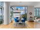 Dining room area with hardwood floors and floor-to-ceiling windows offering lots of light at 905 Juniper Ne St # 808, Atlanta, GA 30309