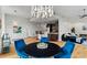 Dining room area showing hardwood floors, modern lighting fixture, and eat-in kitchen at 905 Juniper Ne St # 808, Atlanta, GA 30309