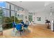 Open concept dining room area with an adjacent kitchen and floor to ceiling windows at 905 Juniper Ne St # 808, Atlanta, GA 30309