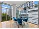 Open dining area with hardwood floors, modern light fixture, and floor-to-ceiling windows at 905 Juniper Ne St # 808, Atlanta, GA 30309