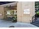 Building entrance at 905 Juniper with glass doors, stone facade, and well-maintained landscaping at 905 Juniper Ne St # 808, Atlanta, GA 30309