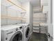 Laundry room featuring washer, dryer, and custom shelving for storage at 905 Juniper Ne St # 808, Atlanta, GA 30309