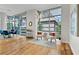 Living area features floor-to-ceiling windows, hardwood floors, modern lighting, and comfortable seating area at 905 Juniper Ne St # 808, Atlanta, GA 30309