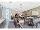 Elegant lounge area with bar, modern lighting, stylish furniture, and a large TV at 905 Juniper Ne St # 808, Atlanta, GA 30309